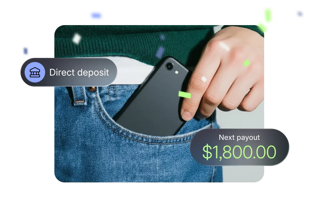 A hand slides a smartphone into a jeans pocket. Floating badges display "Direct deposit" and a next payout of $1,800 USD, indicating reliable, on-time payments.