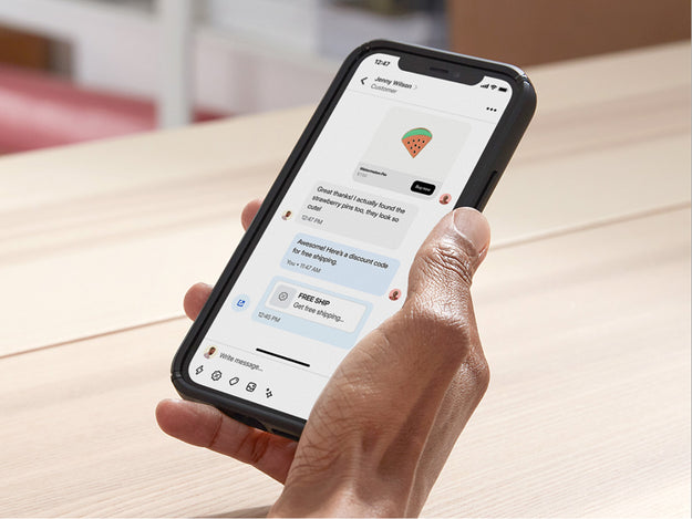 Business owner uses PlatformDTC Inbox to chat with a customer on her mobile device.